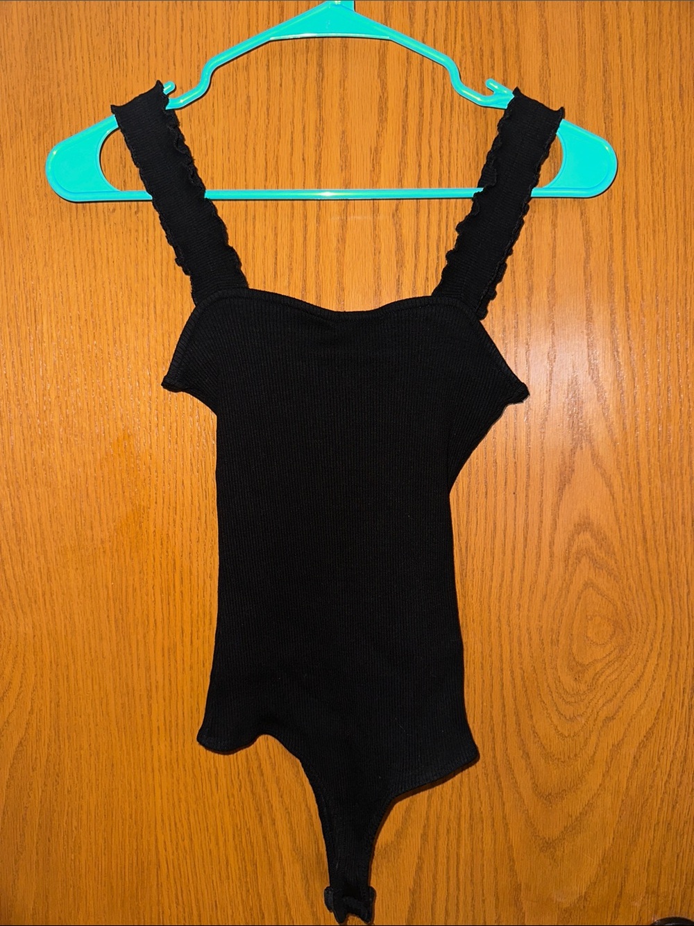 Jolie Black Ribbed One-Piece Bodysuit with Ruffled Straps